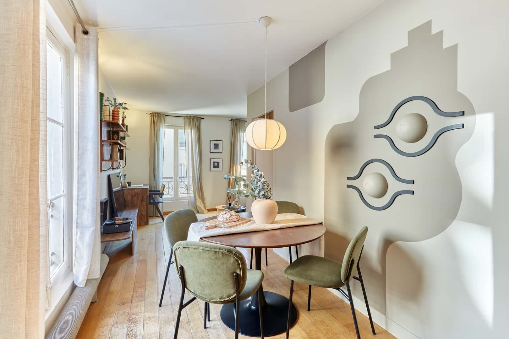 Round table four chairs vase and decor living room at Apartment in 84 Rue des Archives, 75003 Paris, France in Paris Student Accommodation