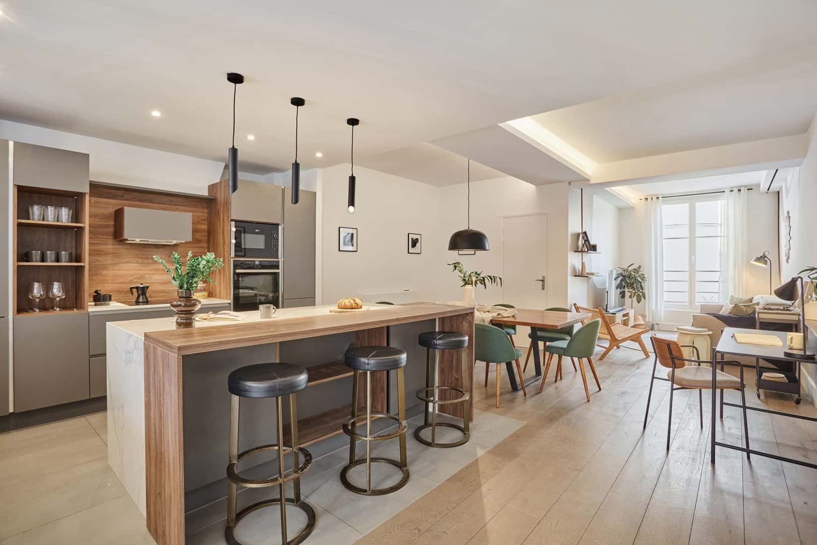 Kitchen island bar stools dining table and desk kitchen at Apartment in 20 Rue du Faubourg Poissonnière, 75010 Paris, France in Paris Student Accommodation