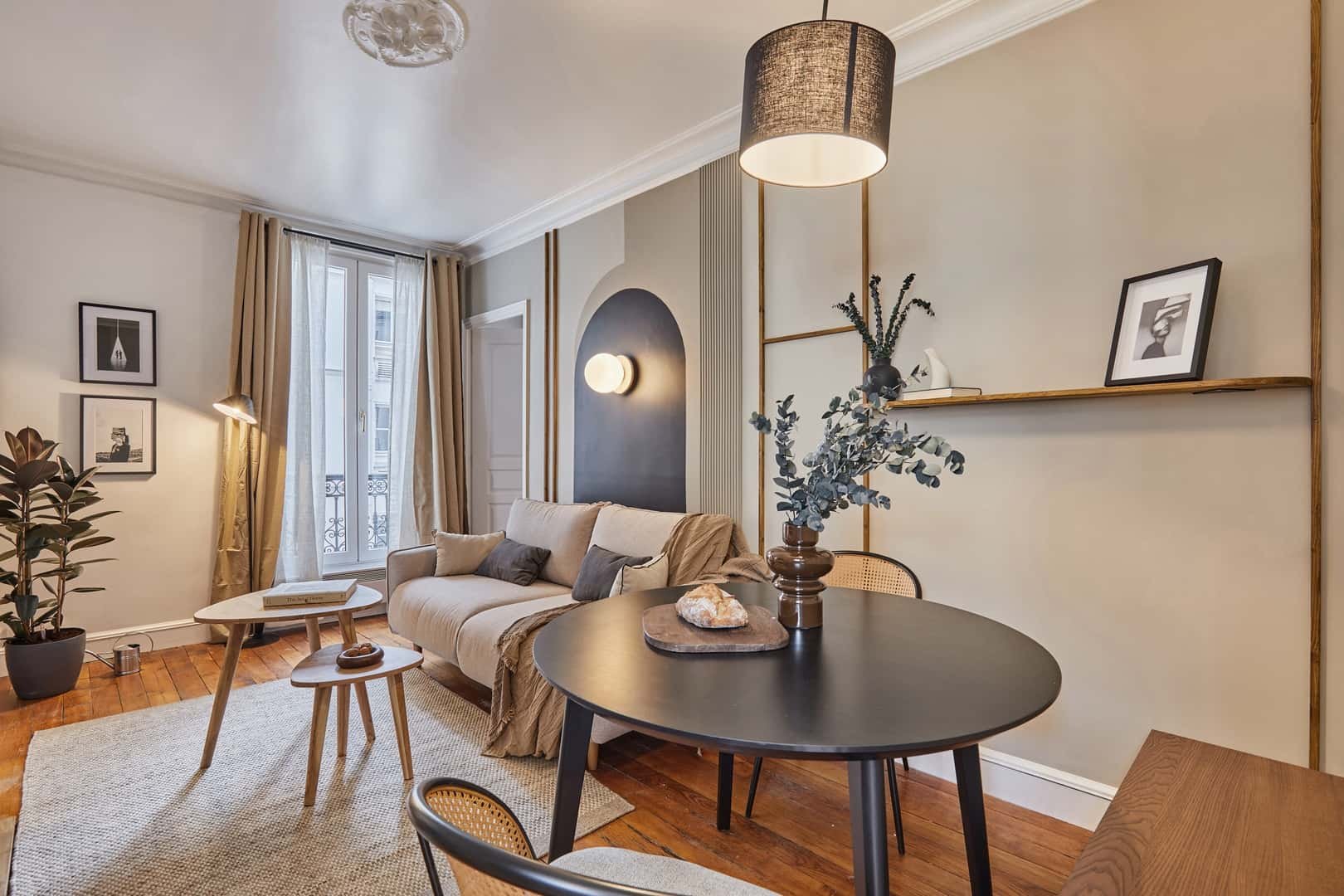 Sofa dining table plant framed art lamp living room at Apartment in 22 Av. Rapp, 75007 Paris, France in Paris Student Accommodation