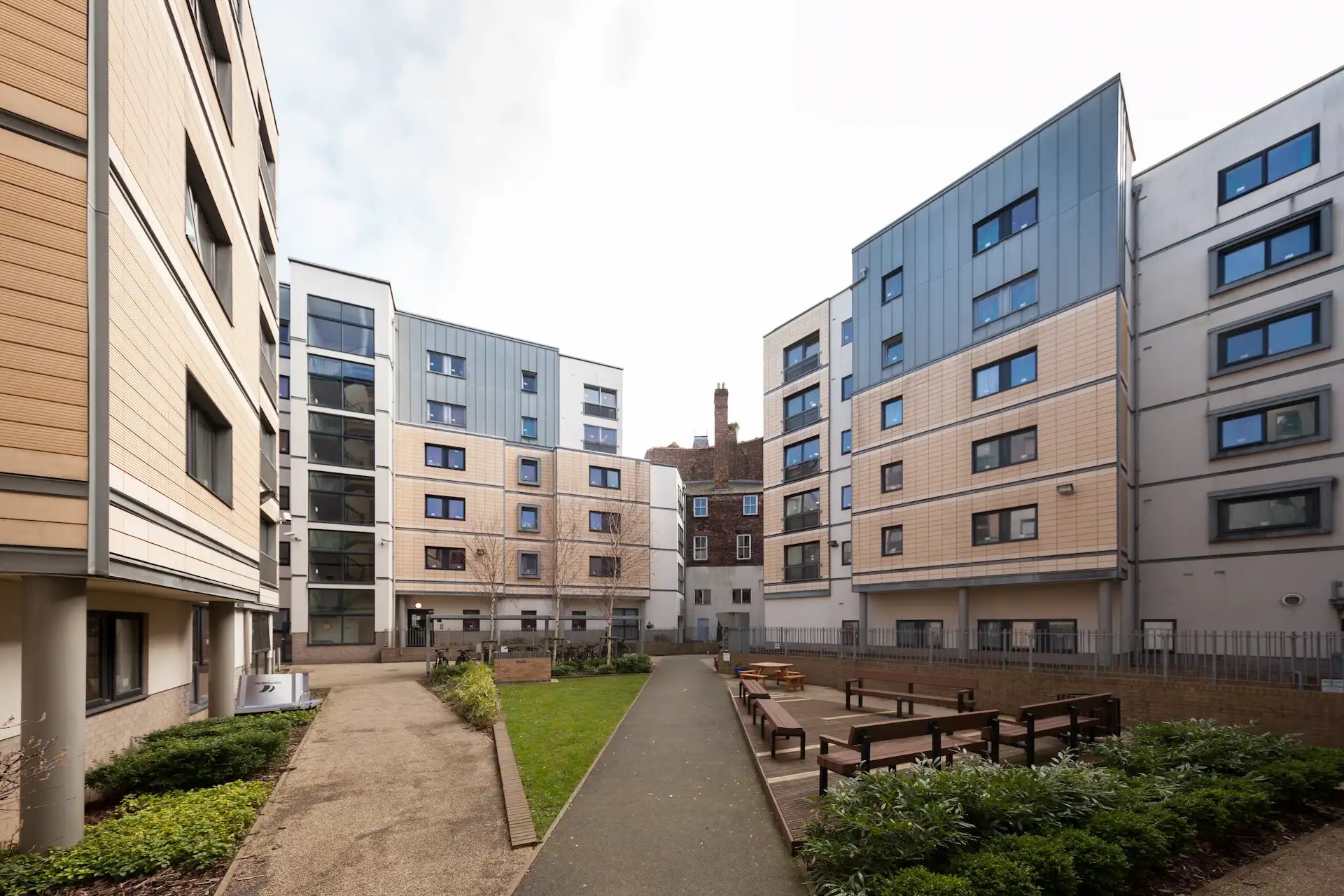 Modern buildings with outdoor seating area exterior at Albert Court in Liverpool Student Accommodation