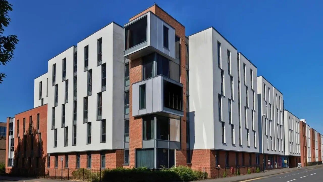Modern building with white brick and glass exterior building at The Apollo Works in Coventry Student Accommodation