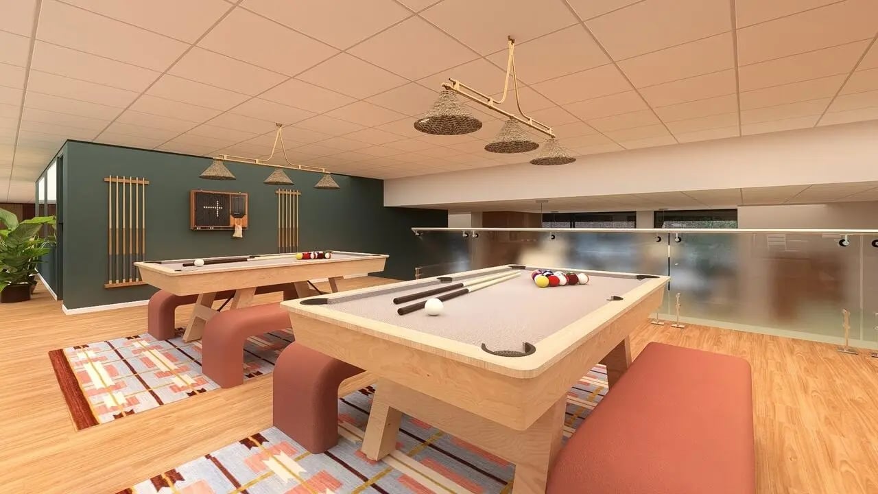 Two pool tables with balls and cues playing area at St James Glasgow in Glasgow Student Accommodation