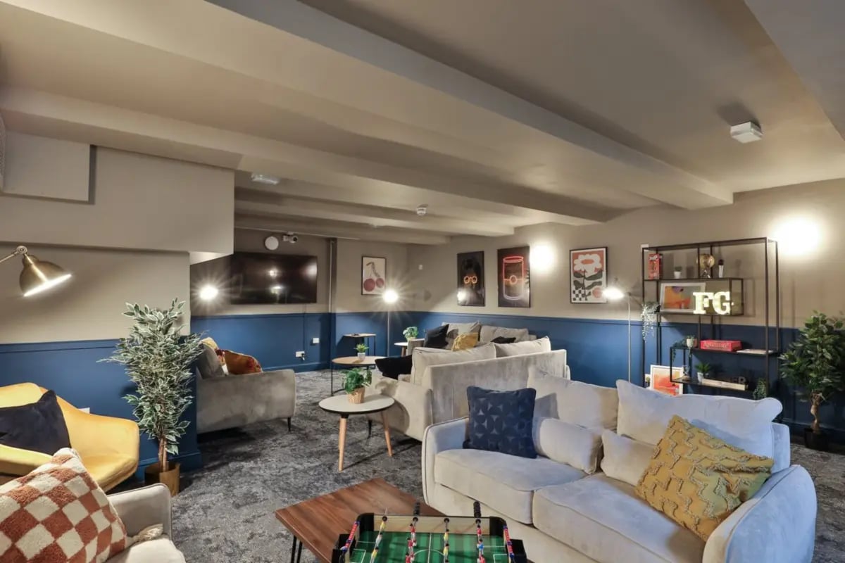 Sofas artwork foosball table living room at Francis Gardner in London Student Accommodation