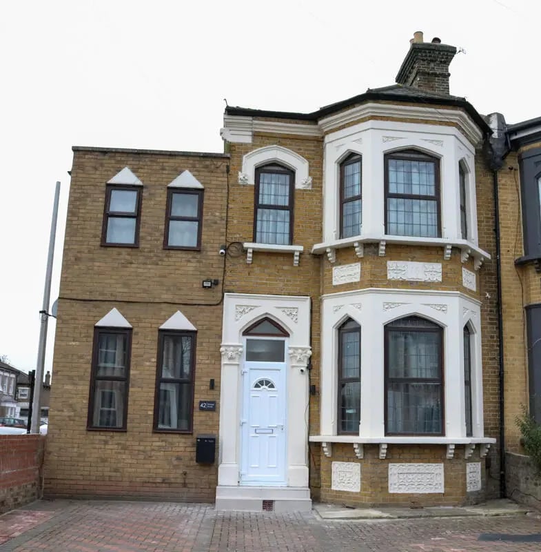 Brick house with white door and windows exterior at 42 Disraeli Rd E7 9JP in London Student Accommodation