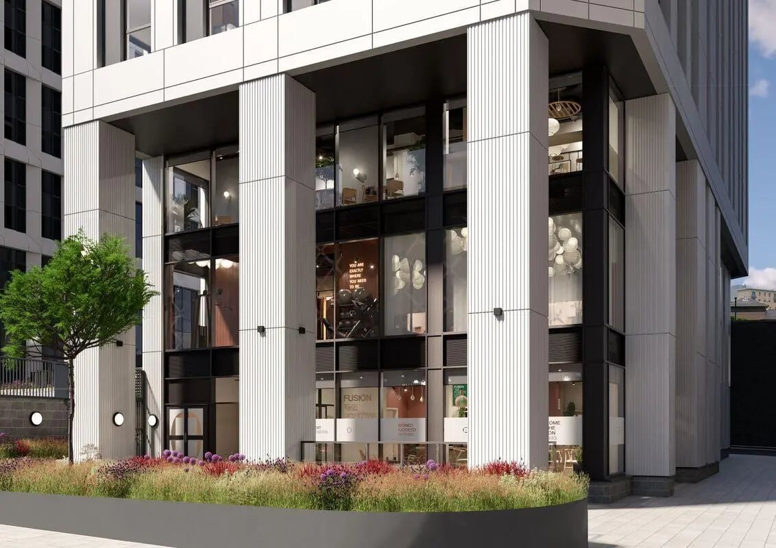 Modern building entrance with gym and seating area exterior at Fusion Leeds in Leeds Student Accommodation