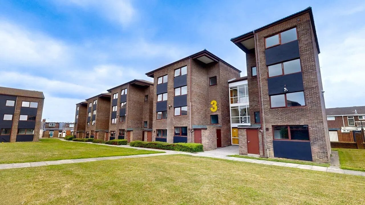 Brick buildings with windows and lawn exterior at Clanny House in Sunderland Student Accommodation