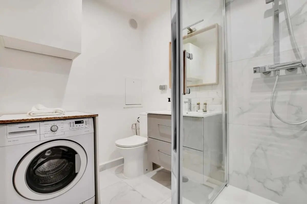 Washing machine toilet vanity shower Bathroom at Studio in 11 Bis Rue Eugène Varlin, 75010 Paris, France in Paris Student Accommodation