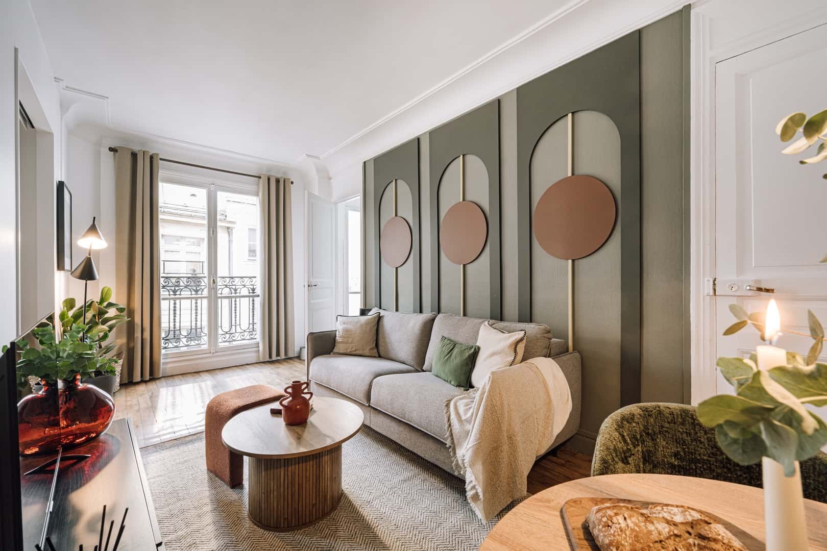 Sofa coffee table plants decorative wall living room at Apartment in 22 Av. de l'Opéra, 75001 Paris, France in Paris Student Accommodation