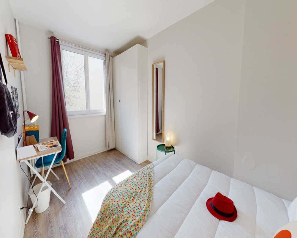 Bed desk wardrobe mirror lamp and chair bedroom at Room in 39 Rue Esquirol, 75013 Paris, France in Paris Student Accommodation