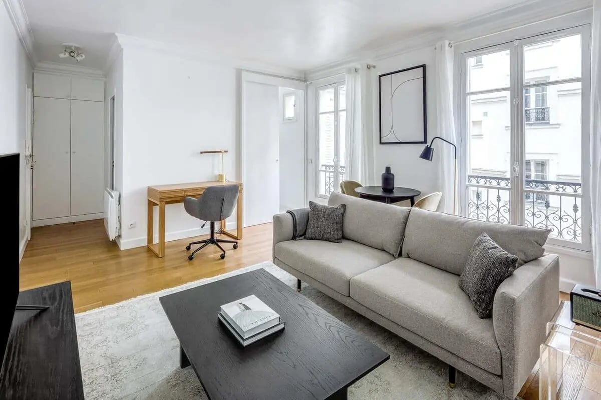 Sofa coffee table desk chair living room at Apartment in 22 Rue Surcouf, 75007 Paris, France in Paris Student Accommodation