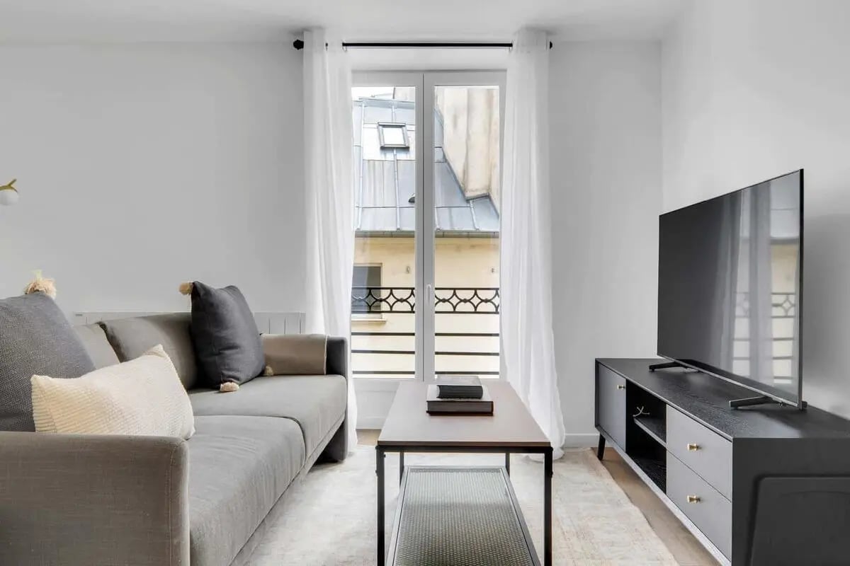 Sofa coffee table and TV living room at Apartment in 6 Rue de l'Echaudé, 75006 Paris, France in Paris Student Accommodation