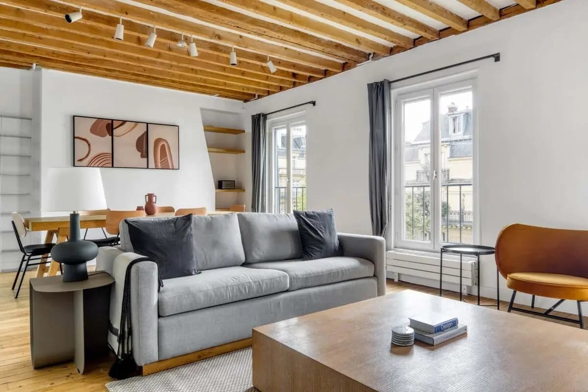 Sofa coffee table art and dining table living room at Apartment in 29 Av. de la Bourdonnais, 75007 Paris, France in Paris Student Accommodation
