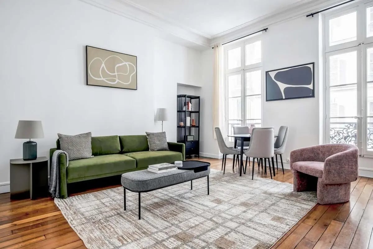 Green sofa, dining table, chairs, armchair living room at Apartment in 41 Rue de Bourgogne, 75007 Paris, France in Paris Student Accommodation