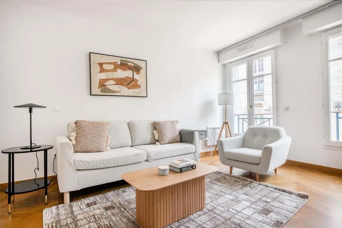 Sofa armchair coffee table and rug living room at Apartment in 3 Rue du Pont de Lodi, 75006 Paris, France in Paris Student Accommodation