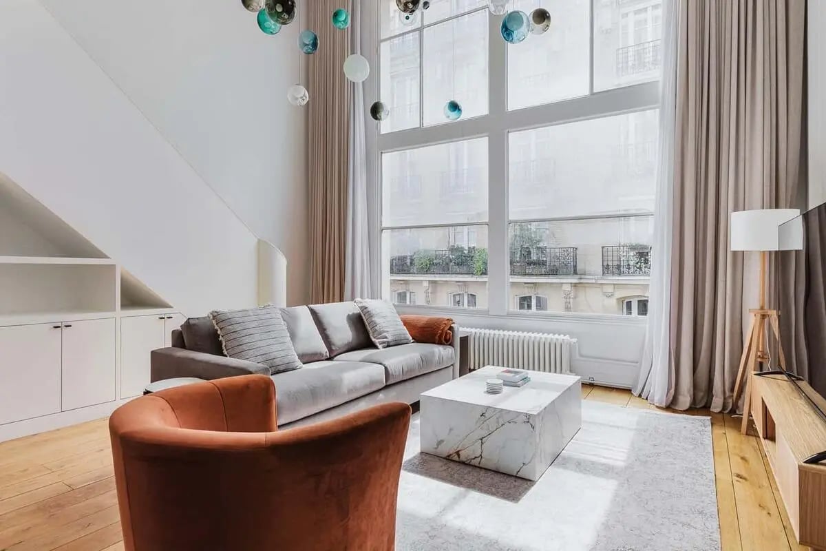 Sofa marble coffee table bookcase living room at Apartment in 16 Rue de Saint-Simon, 75007 Paris, France in Paris Student Accommodation