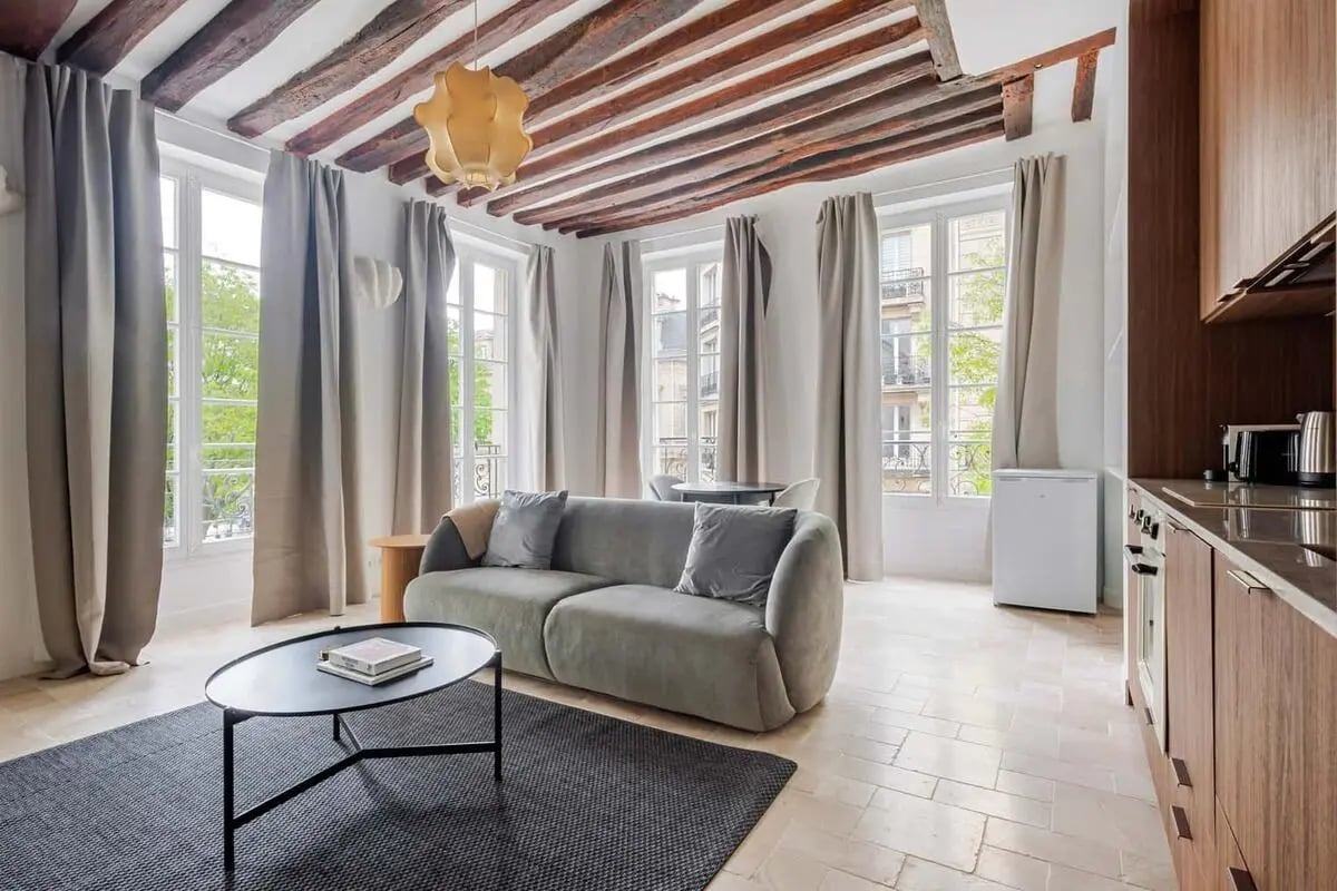 Sofa coffee table and kitchen living room at Apartment in 18 Rue de Beauce, 75003 Paris, France in Paris Student Accommodation