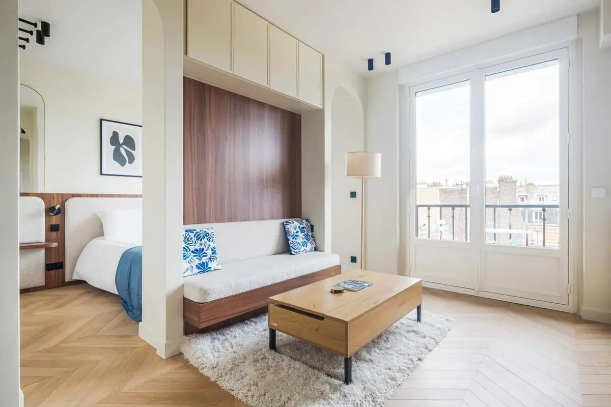 Bed sofa coffee table rug living room at Apartment in 5 Rue de Gribeauval, 75007 Paris, France in Paris Student Accommodation