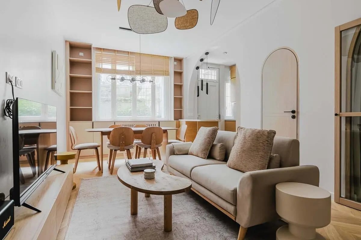 Sofa dining table and TV living room at Apartment in 8 Rue Degas, 75016 Paris, France in Paris Student Accommodation