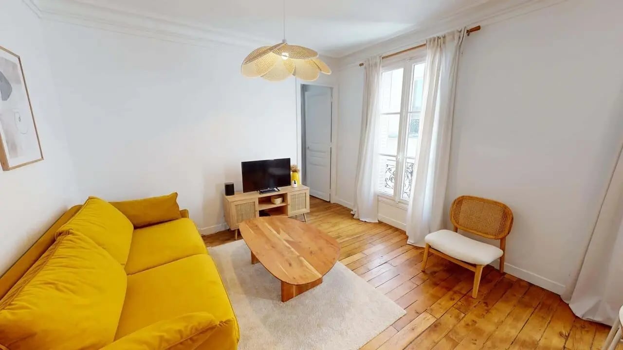 Yellow couch TV and coffee table living room at Apartment in 61 Rue Pascal, 75013 Paris, France in Paris Student Accommodation