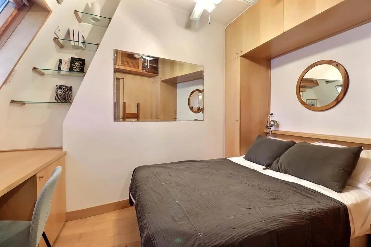 Bed desk mirror and shelves bedroom at Apartment in Rue de Rome, 75008 Paris, France in Paris Student Accommodation