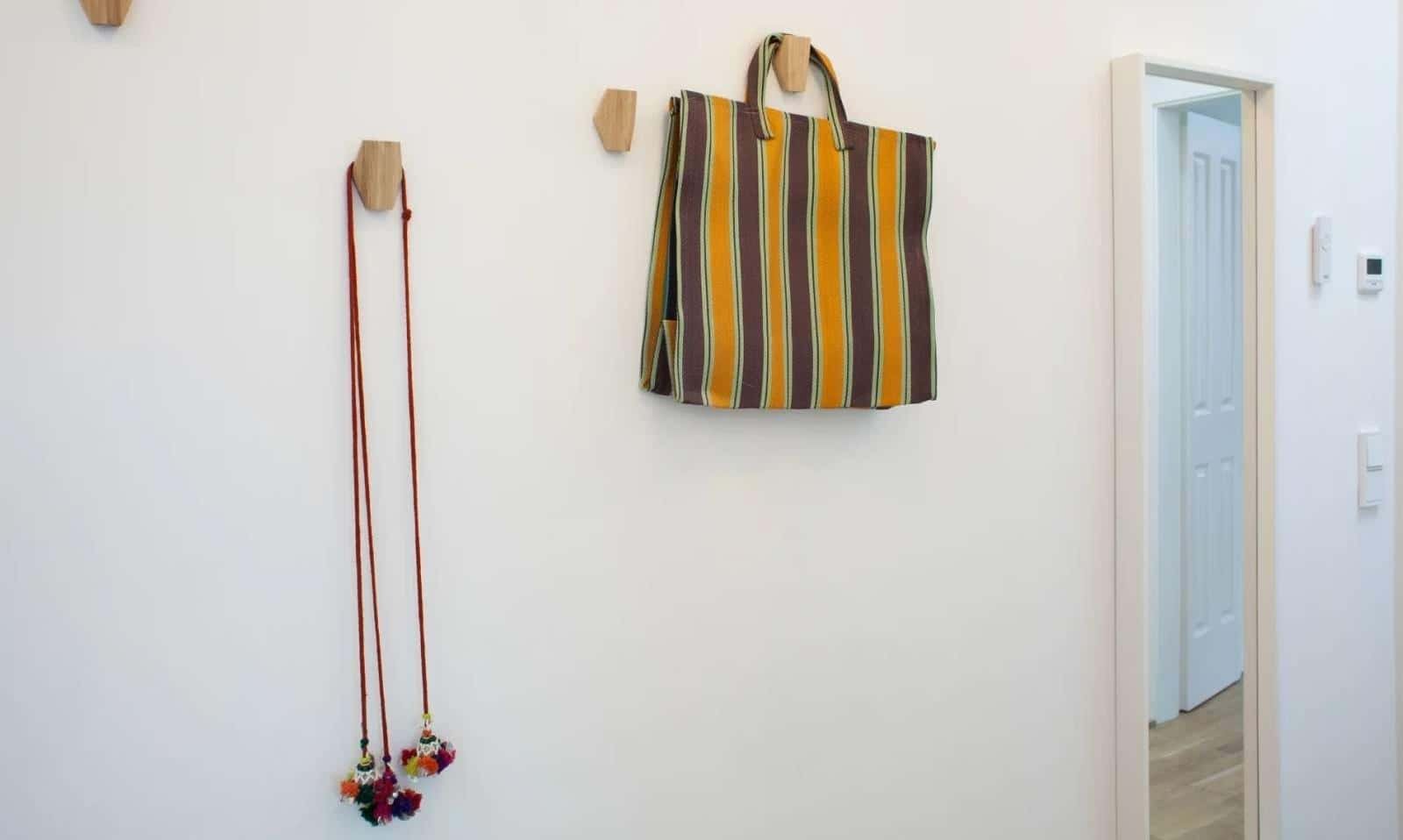 Striped bag red cord with tassels hooks hallway at Apartment in Dirschauer Str., 10245 Berlin-Bezirk Friedrichshain-Kreuzberg, Germany in Berlin Student Accommodation
