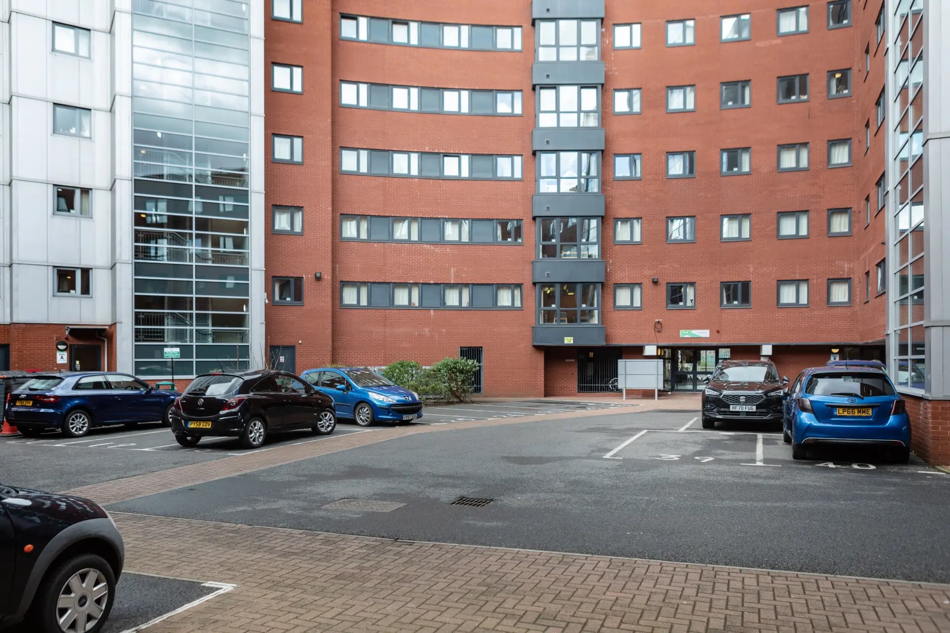 Apartment building cars parked exterior at Belgrave View in Birmingham Student Accommodation