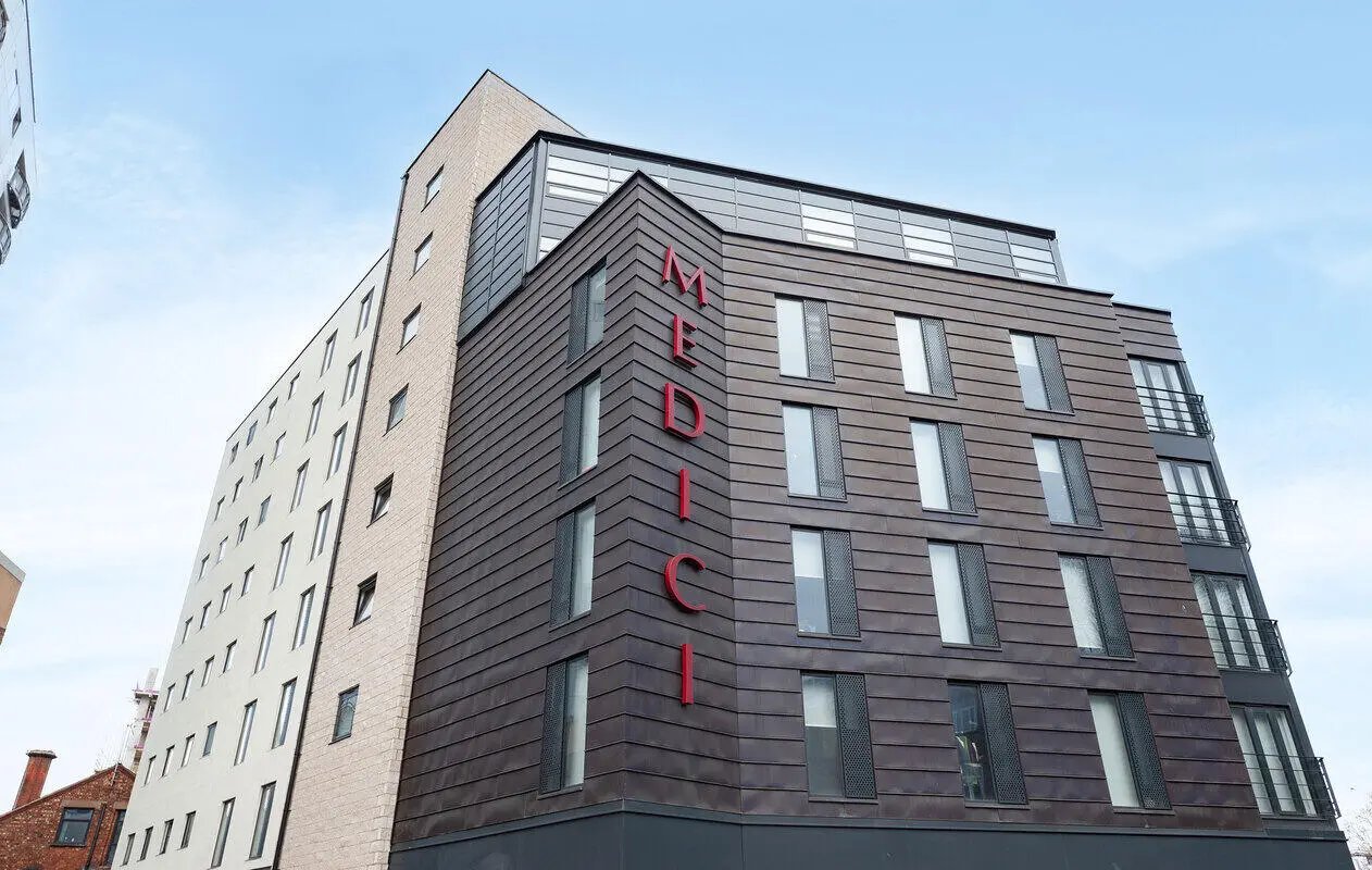 Medici building sign red letters modern exterior exterior at Medici in Nottingham Student Accommodation