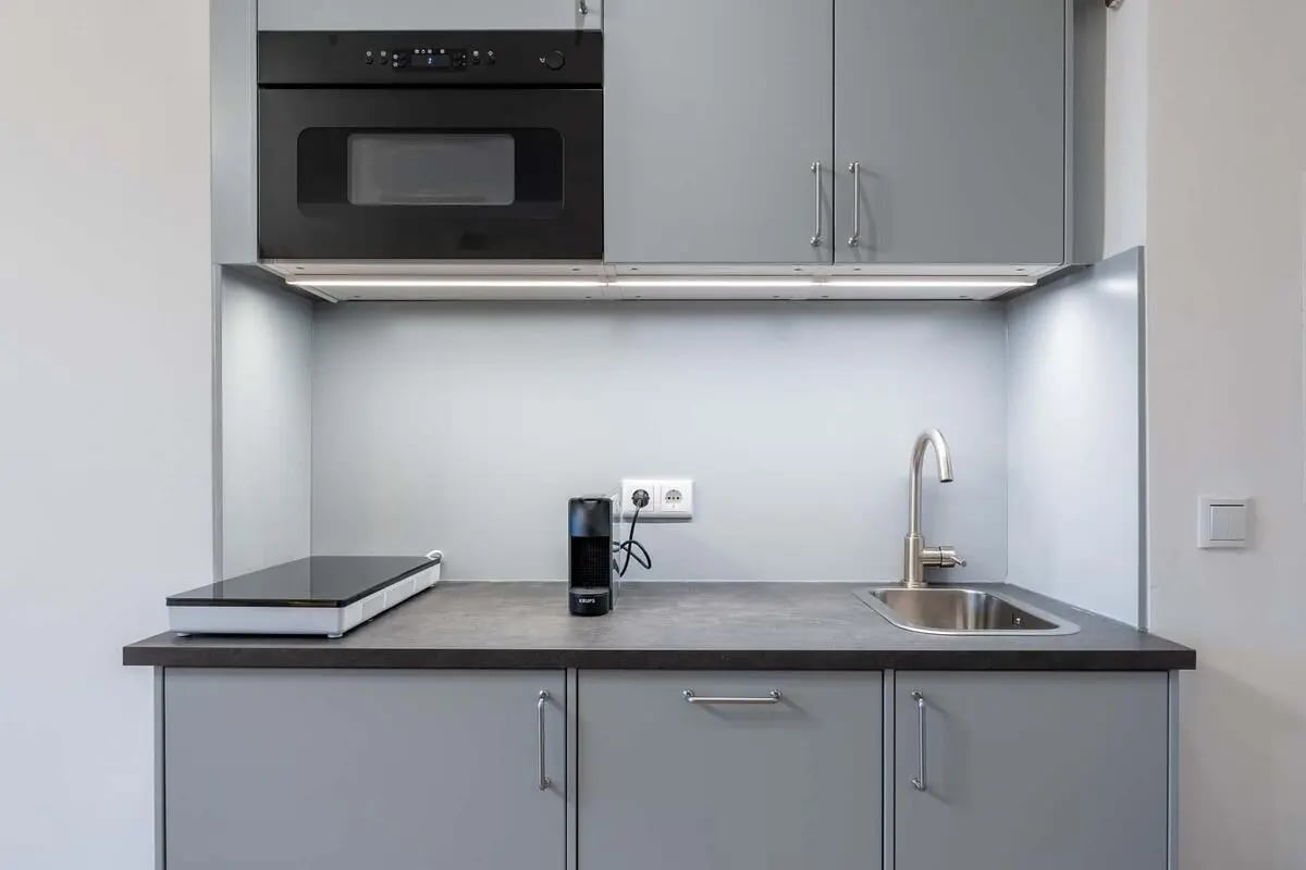 Microwave sink induction cooktop coffee maker kitchen at Apartment in Damaschkestraße 7, 10711 Berlin, Deutschland in Berlin Student Accommodation