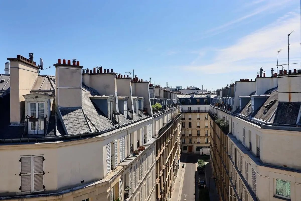 Parisian apartment buildings with multiple chimneys exterior at Apartment in Rue Berthollet, 75005 Paris, France in Paris Student Accommodation