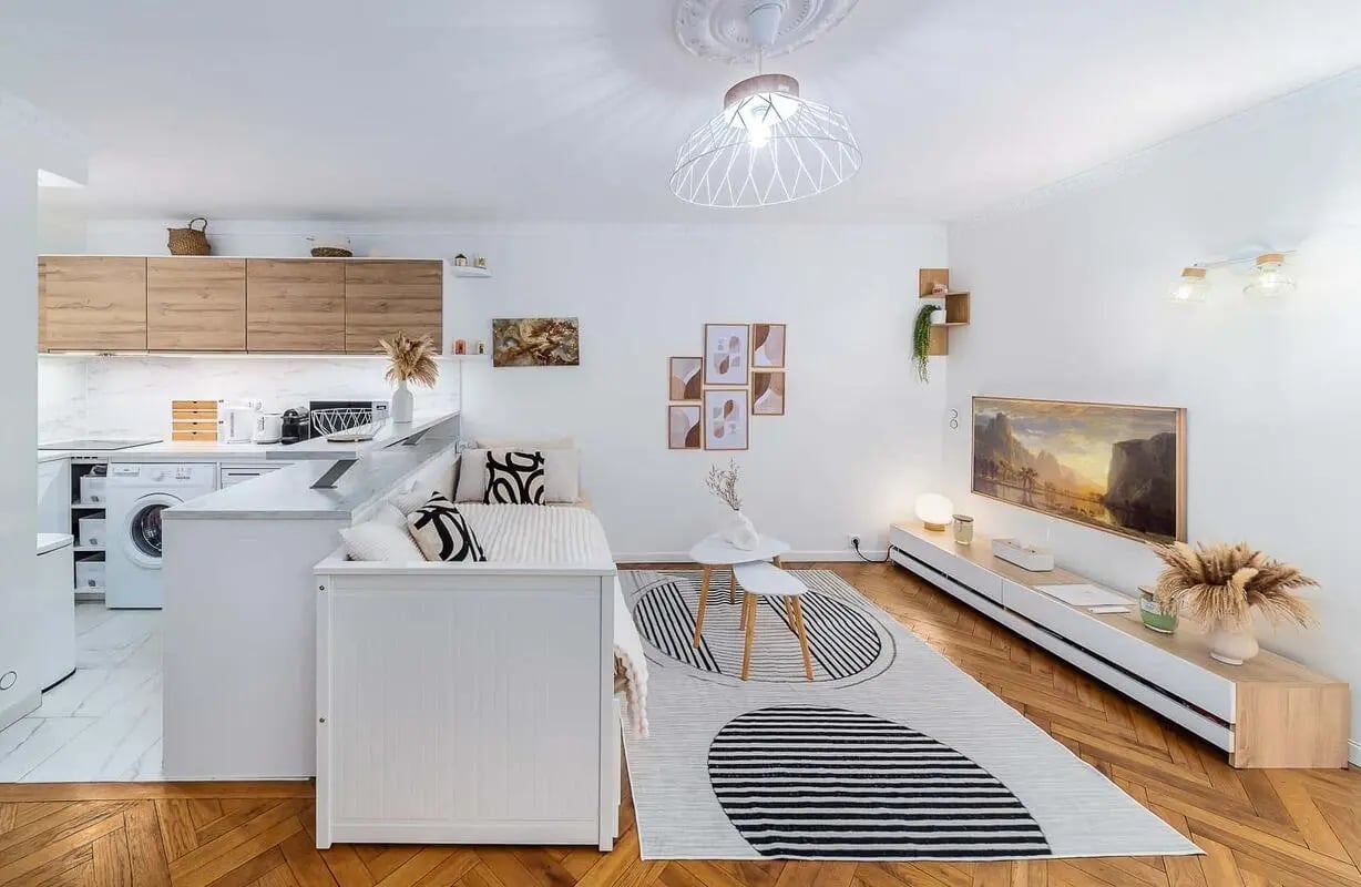 Kitchen sofa bed rug television living room at Apartment in 25 Bd de Port-Royal, 75013 Paris, France in Paris Student Accommodation