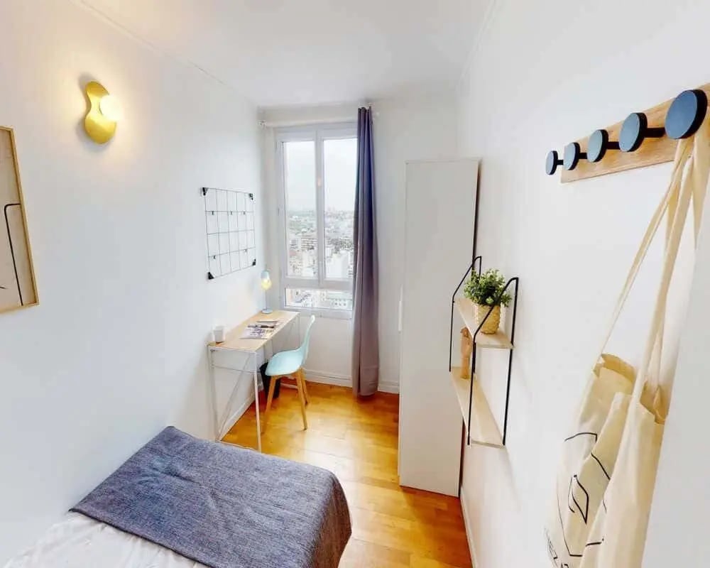 Bed desk chair shelves tote bag bedroom at Chambre dans le avenue de Flandre in Paris Student Accommodation
