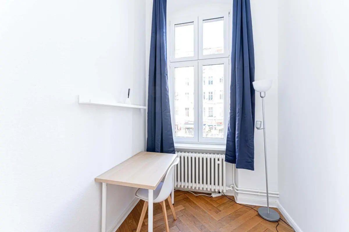 Desk chair shelf and window study area at Kaiser-Friedrich-Straße - Room 1 in Berlin Student Accommodation