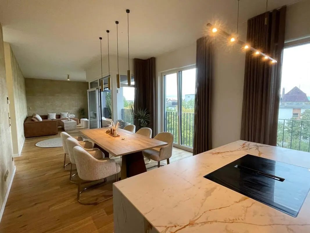 Modern dining set marble island induction hob living area at Apartment in Rosenheimer Straße, Berlin for 140 m² with 4 bedrooms in Berlin Student Accommodation