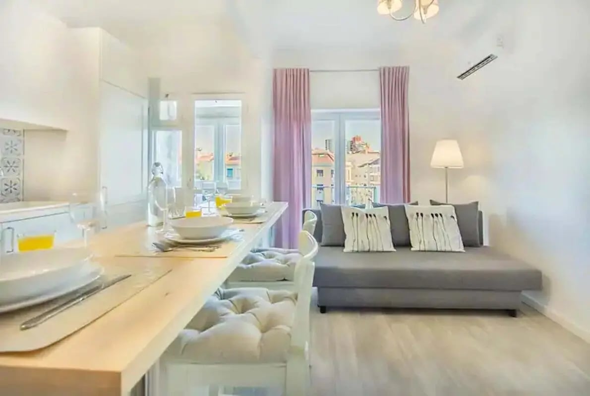 Dining bar with seating and sofa Living room at Travessa Henrique Cardoso in Lisbon Student Accommodation