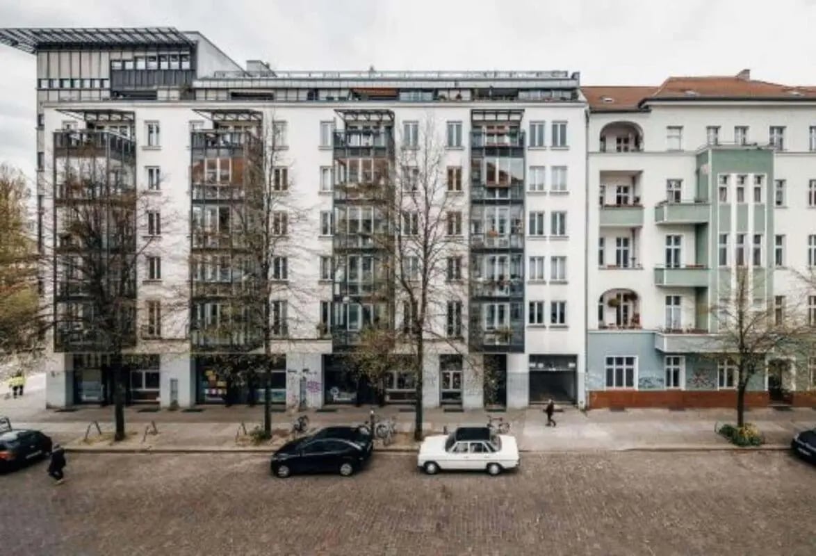 Apartment building with balconies and cars exterior at 1-bedroom apartment for rent in Berlin, bills included in Berlin Student Accommodation