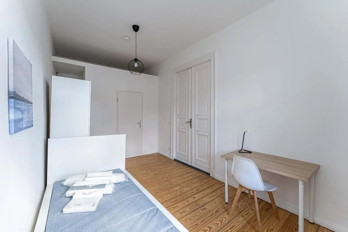 Bed desk lamp and chair student bedroom at Gabriel-Max-Straße - Room 4 in Berlin Student Accommodation