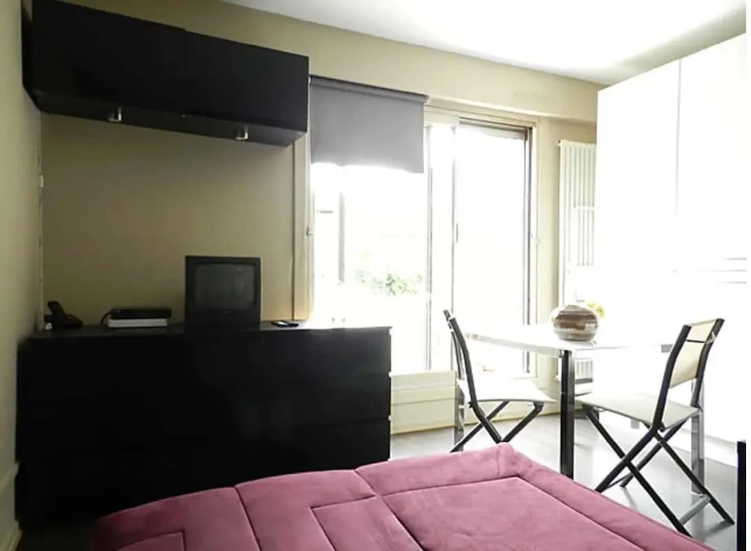 Black dresser with TV table and chairs living room at Studio in Rue Mademoiselle, 75015 Paris, France in Paris Student Accommodation