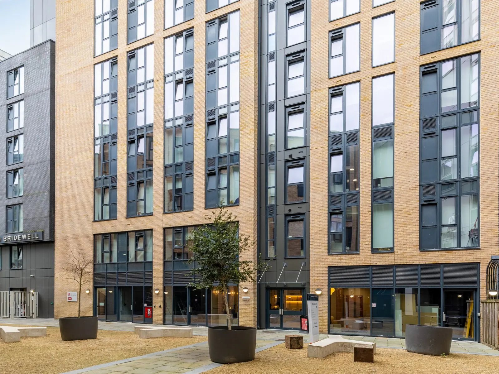 Modern brick building with large windows exterior at New Bridewell in Bristol Student Accommodation