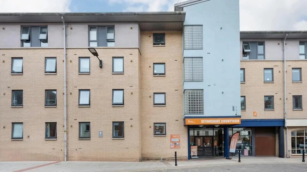 Brick building with many windows exterior at Devonshire Courtyard in Sheffield Student Accommodation