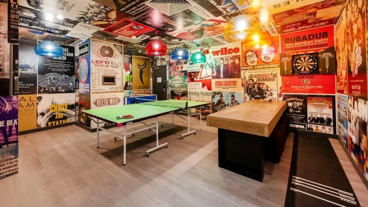 Ping pong table dartboard and seating area recreation room at Gallery Apartments in Glasgow Student Accommodation