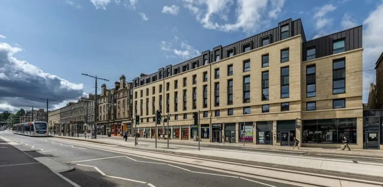 Modern building shops on lower floors exterior at Haddington Place in Edinburgh Student Accommodation