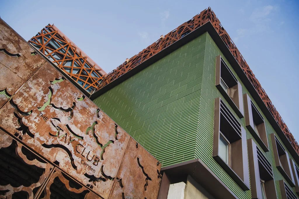 Rusty decorative panels green siding windows exterior at The Stay Club - Camden in London Student Accommodation