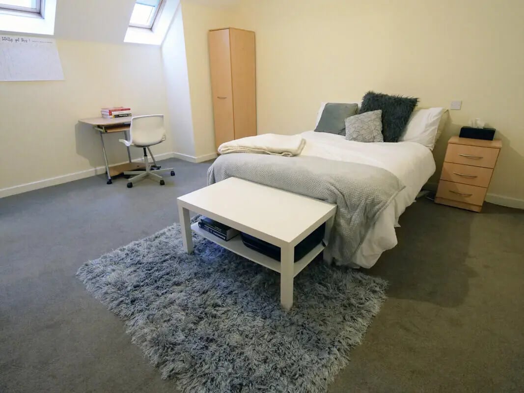 Bed desk wardrobe and dresser bedroom at Hassells Bridge House in Newcastle Under Lyme Student Accommodation