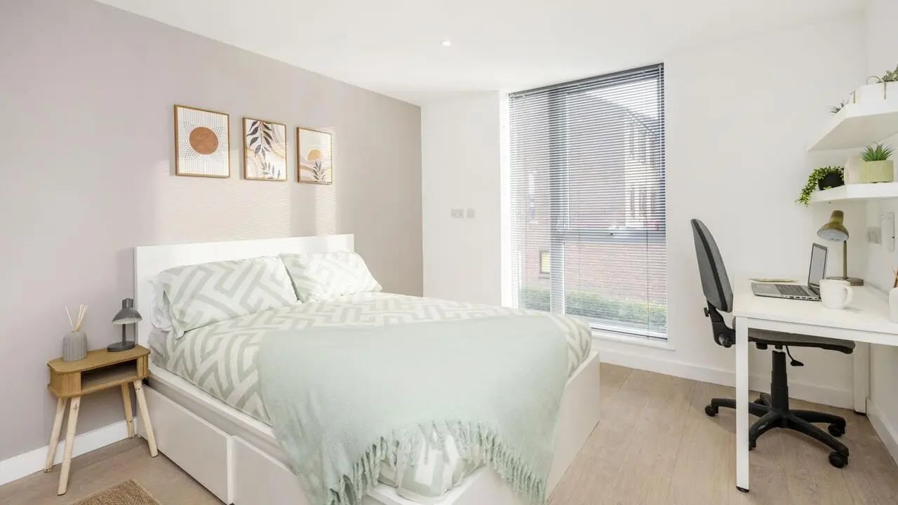 Bed desk artwork and chair bedroom at Sizer Court in Preston Student Accommodation