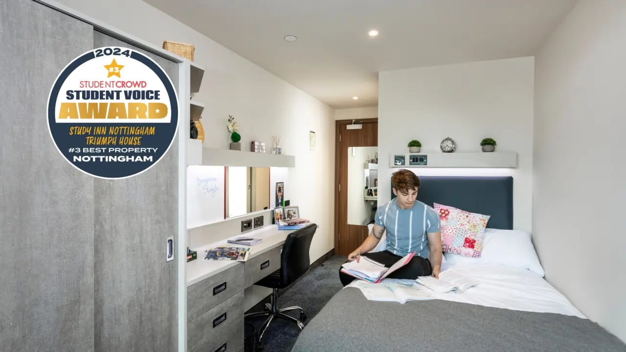 Student studying in a modern bedroom with bed and desk Bedroom at Triumph House in Nottingham Student Accommodation