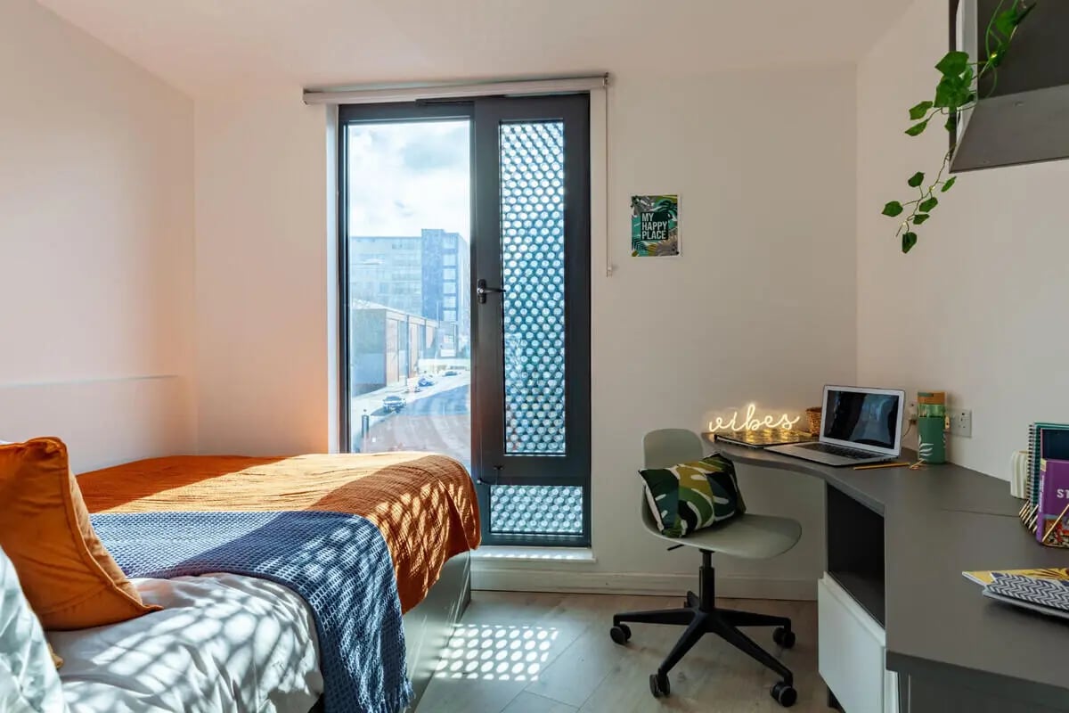 Bed desk laptop and chair bedroom at Medici in Nottingham Student Accommodation