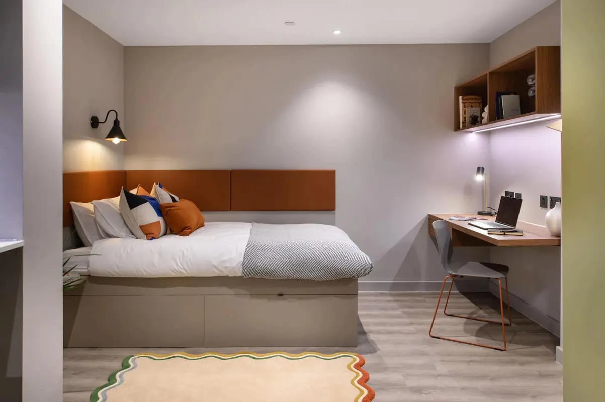 Bed desk with laptop and chair bedroom at The Pepper Mill in Edinburgh Student Accommodation