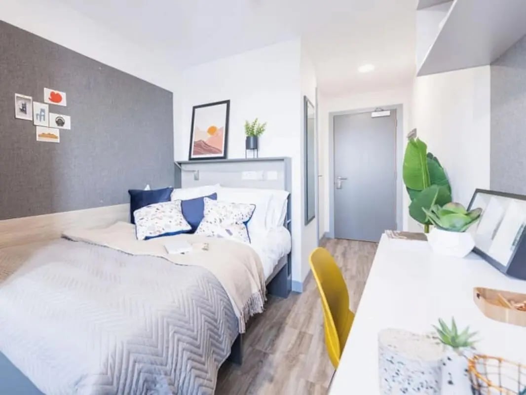 Bed desk and yellow chair bedroom at Onyx Birmingham in Birmingham Student Accommodation