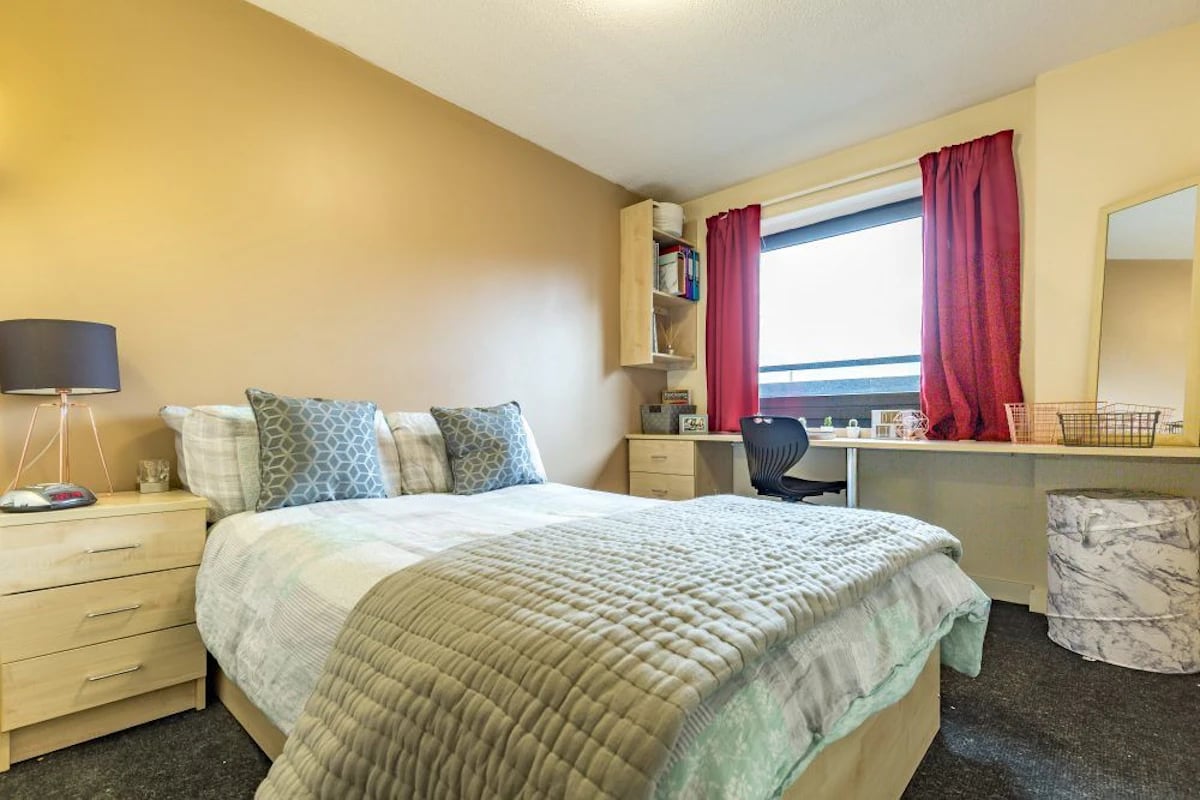 Bed desk lamp and pillows bedroom at The Pinnacles in Sheffield Student Accommodation