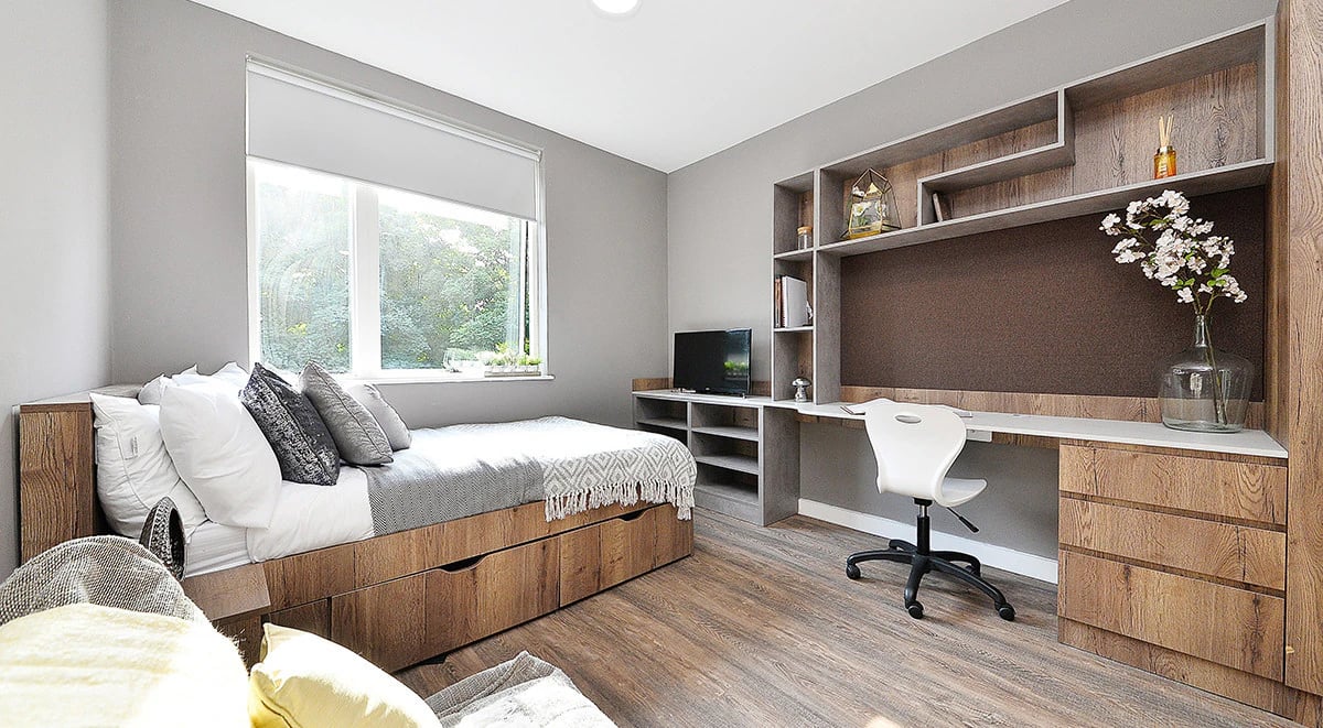 Bed desk television storage shelves bedroom at 800 Bristol Road in Birmingham Student Accommodation